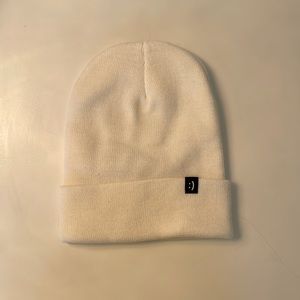 Flip rings brand white beanie with flip smile detail